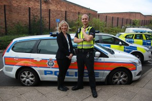 Alex and colleague stand proudly with the MH01 mental health street triage car