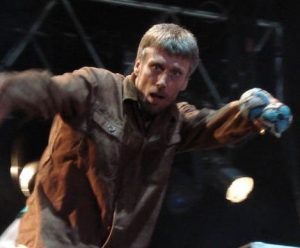 Bez out of Happy Mondays shakes his maracas on stage