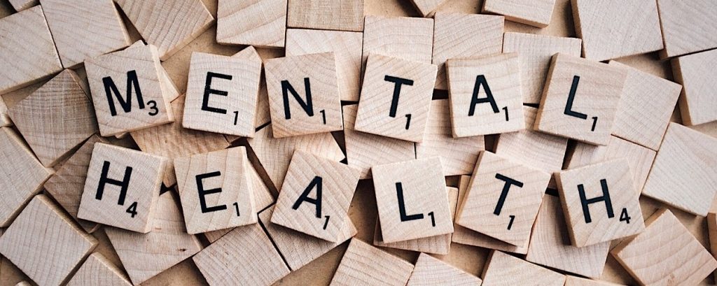 The words 'mental health' illustrated as scrabble letters