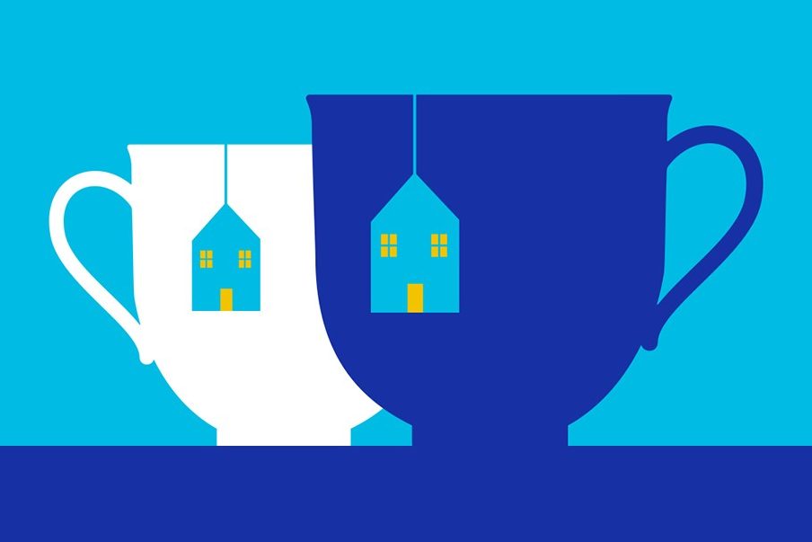 Two tea cup images with tea bag tags in the shape of houses hanging over the side