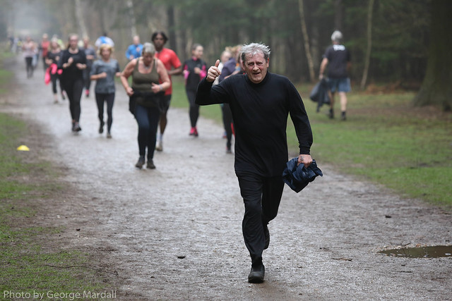 Older man on a park run with other runners