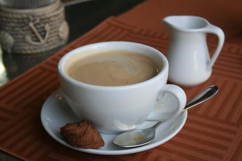 Coffee cup and a biscuit