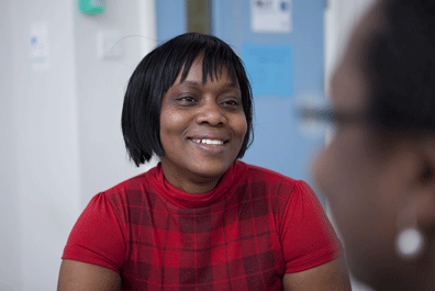 Social care manager smiling in conversation