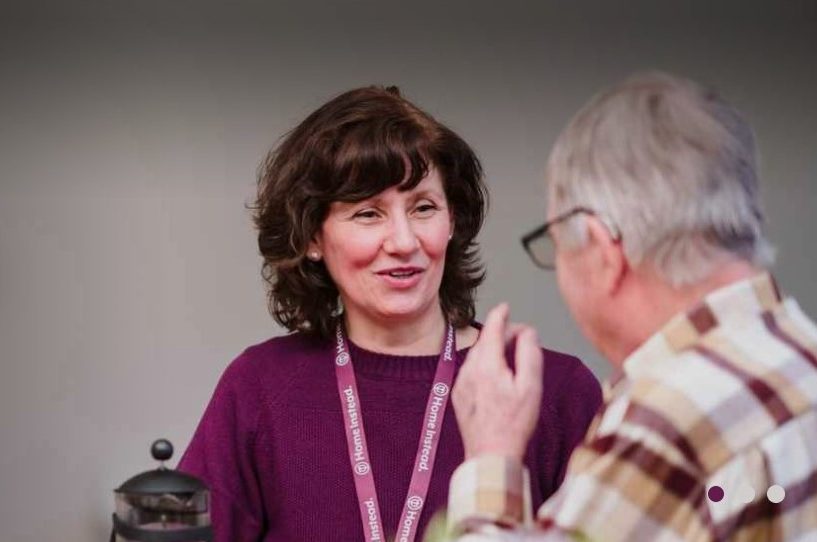 HomeInstead care colleague chatting with resident