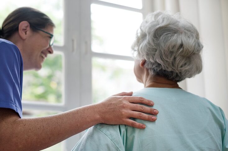 Care colleague smiling at resident