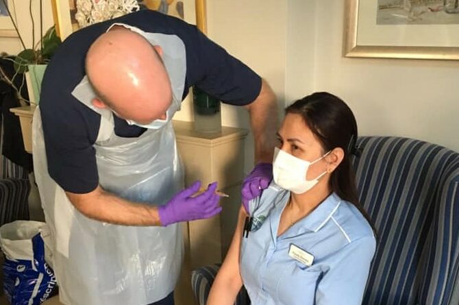 Care home colleague being vaccinated