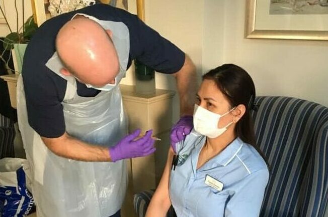 Care home colleague being vaccinated