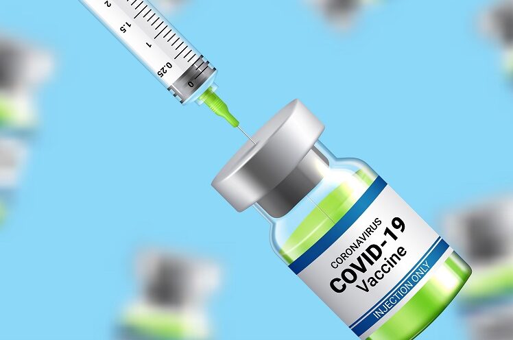 COVID-19 vaccine vial and syringe