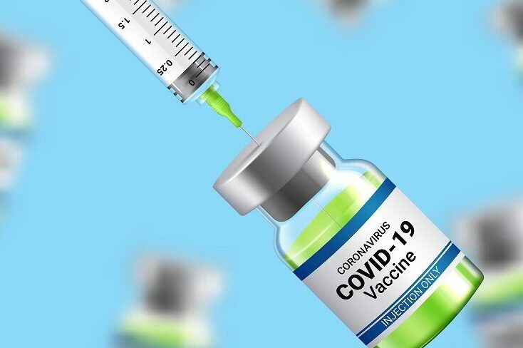 COVID-19 vaccine vial and syringe