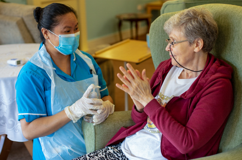 Care colleague talking to resident