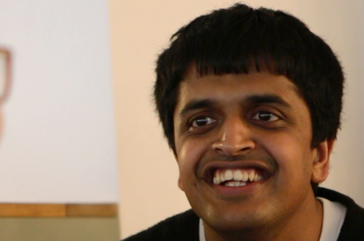 Young man with learning disability smiling