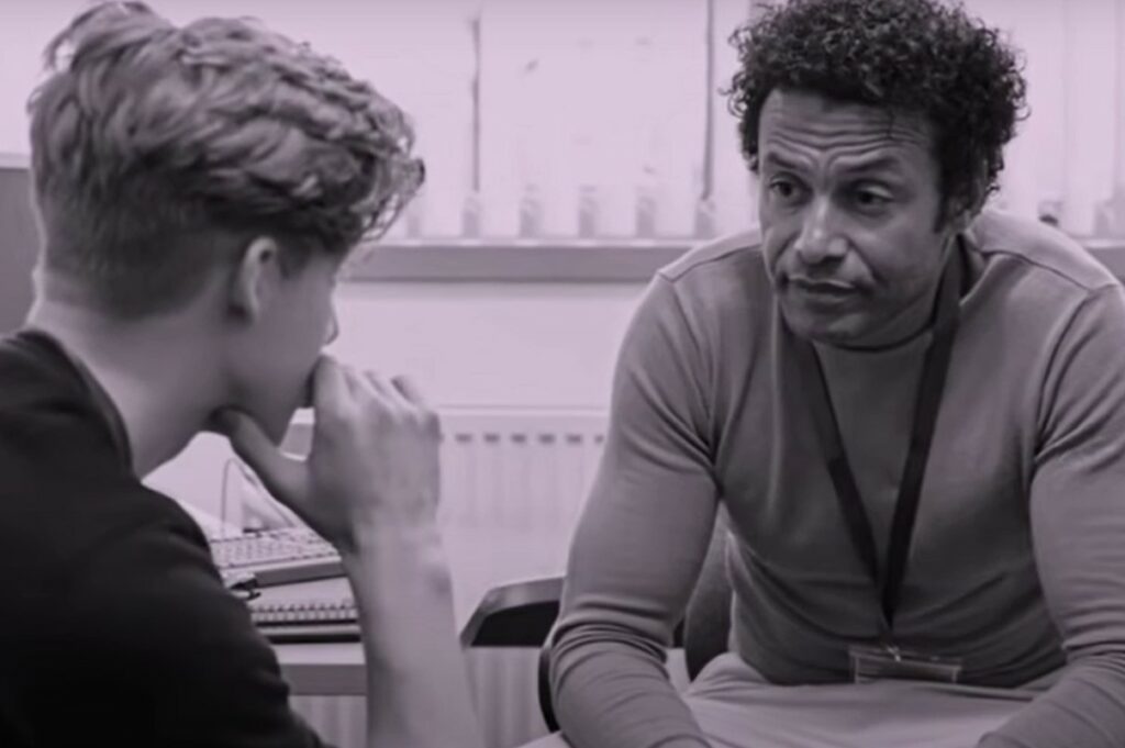Care worker and young man in conversation