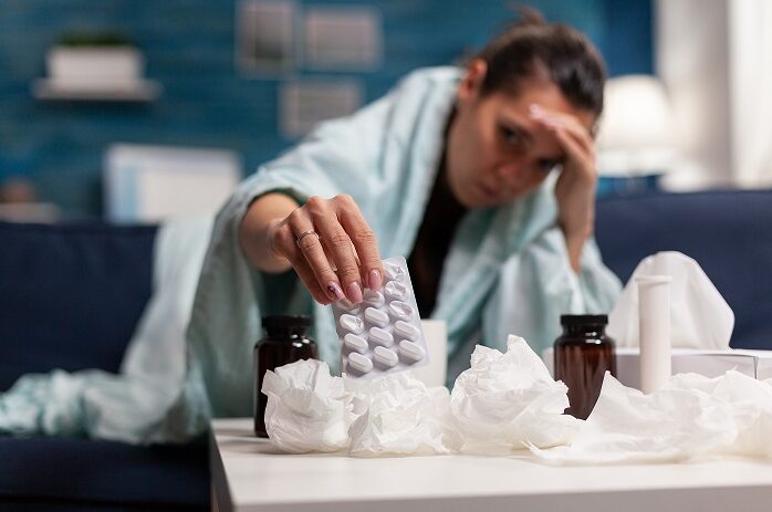 Sick woman having seasonal illness at home