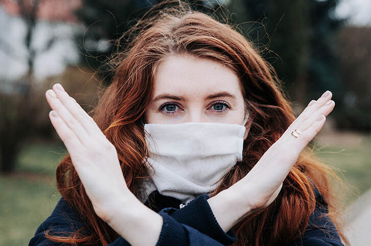 Woman makes the break the bias sign