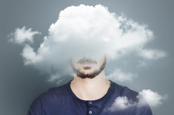 Man with head in fog