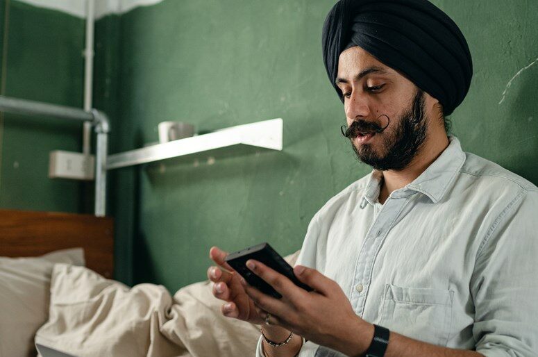 Man in turban with person he cares for