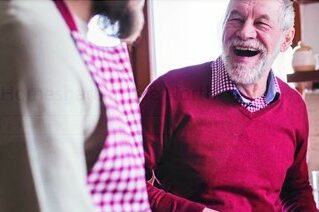 man laughing with carer