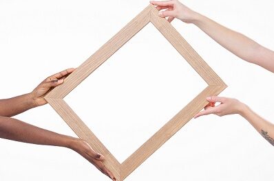 people-holding-wooden-frame.