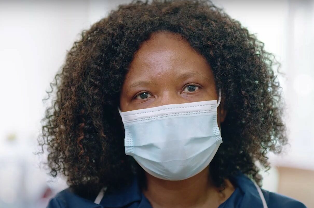 Social care nurse wearing face mask