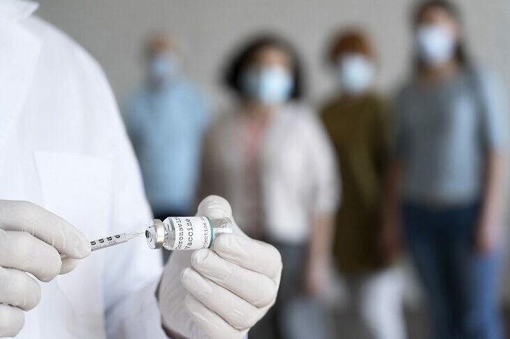 People queuing to be vaccinated