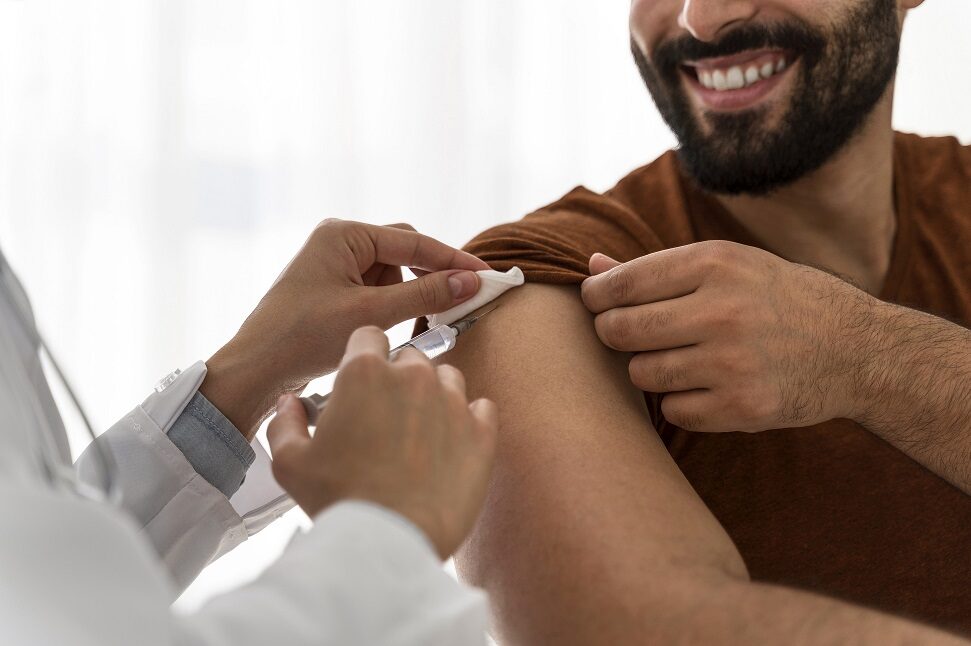 doctor-vaccinating-smiley-man