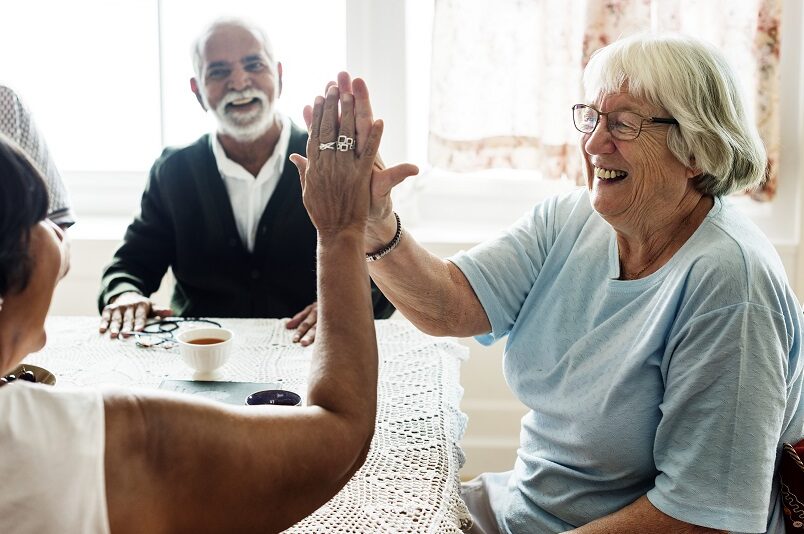 Senior citizens high fiving