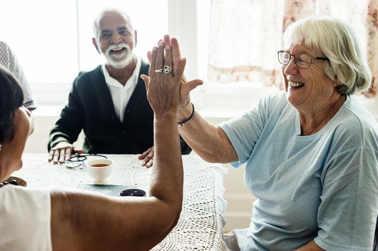 Senior citizens high fiving