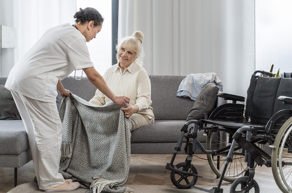 Nursing home colleague assisting a resident 