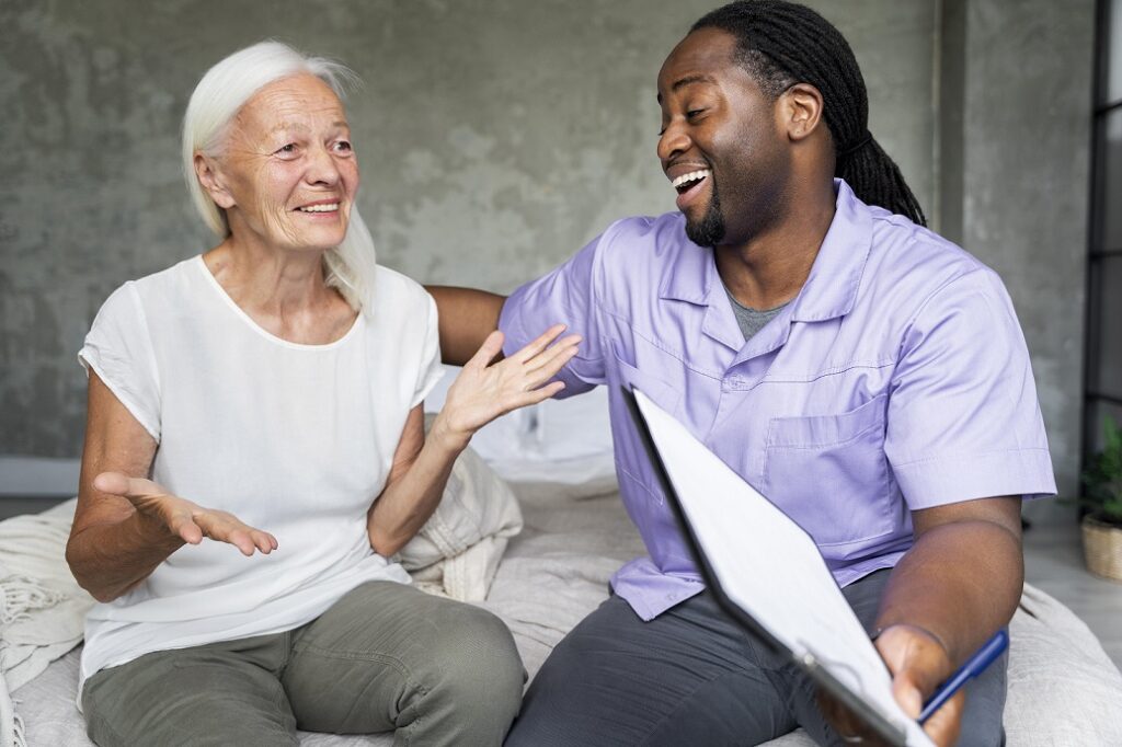 Happy care worker with happy older woman