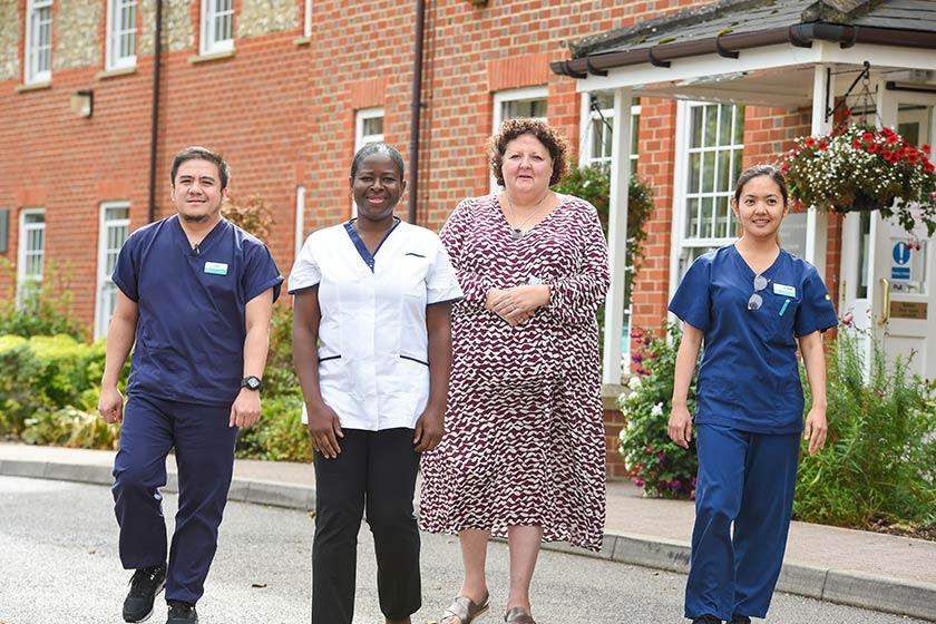 Chief Nurse Deborah Sturdy poses with staff from Watlington Care Home, 2023